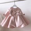 Rochie de botez din tafta roz cu fundite pentru fetite Cerise