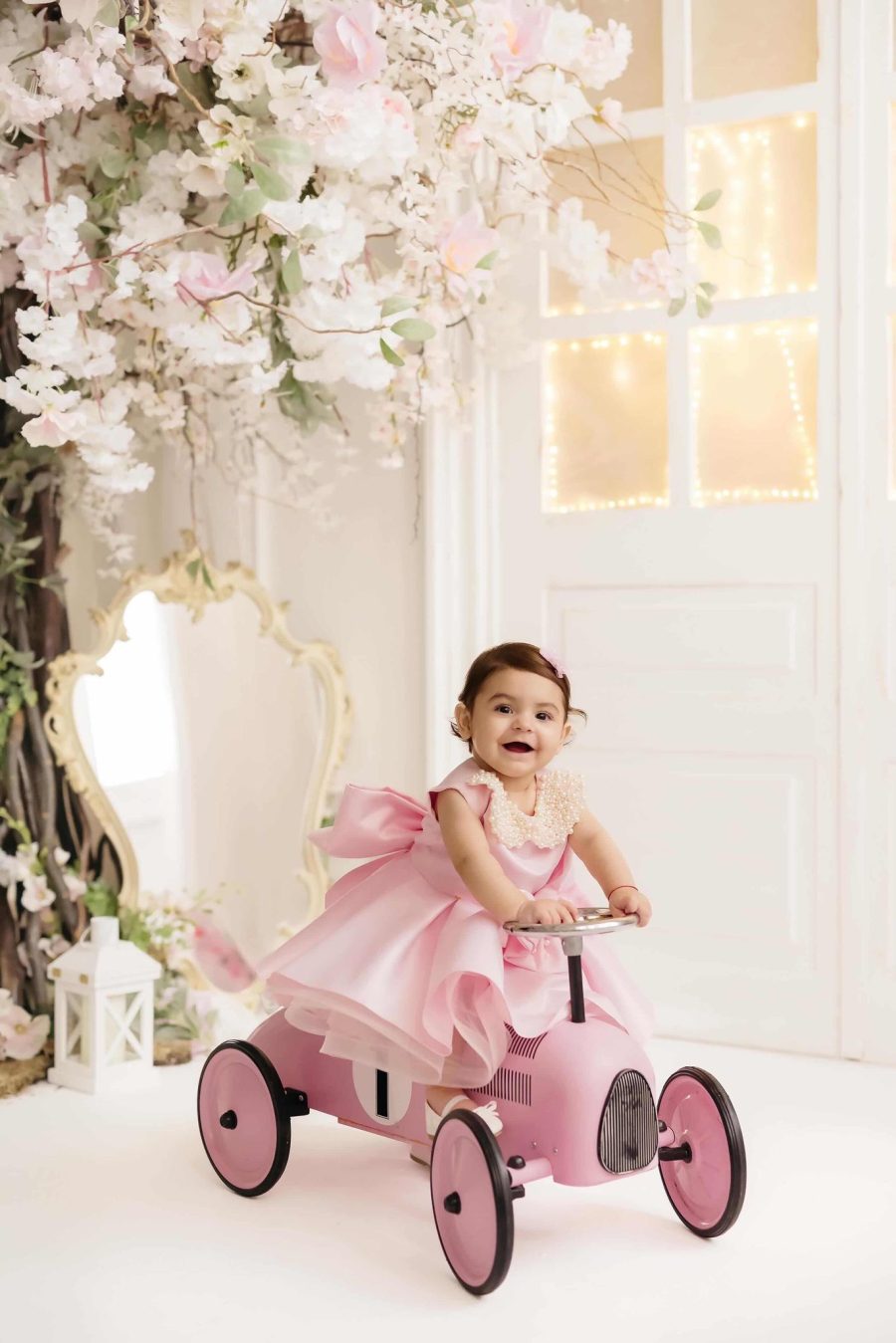 Rochie botez roz cu fundite si perle pentru fetite May